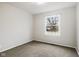 Bedroom with neutral carpet, large window, and white walls at 3407 Allison Ave, Indianapolis, IN 46224