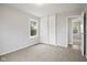 Bright bedroom with carpeted floors, a double closet and natural light from the window at 3407 Allison Ave, Indianapolis, IN 46224