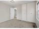 Bedroom with neutral carpet, two closets with doors, and white walls at 3407 Allison Ave, Indianapolis, IN 46224