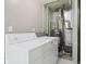 The Laundry room features a washing machine and dryer, with an adjacent hot water tank and HVAC system at 3407 Allison Ave, Indianapolis, IN 46224