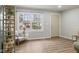 Bright living room showcasing new wood flooring, a large window and neutral paint at 3407 Allison Ave, Indianapolis, IN 46224
