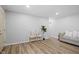 Inviting living room featuring new wood flooring and neutral paint tones with light colored furniture at 3407 Allison Ave, Indianapolis, IN 46224