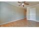 Bedroom featuring hardwood floors, crown molding, and a ceiling fan at 355 E Ohio St # 310, Indianapolis, IN 46204