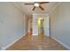 Bedroom featuring hardwood floors, a ceiling fan, and walk in closet access at 355 E Ohio St # 310, Indianapolis, IN 46204