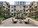 Charming courtyard featuring lush landscaping, a tranquil fountain, and comfortable seating for relaxing outdoor enjoyment at 355 E Ohio St # 310, Indianapolis, IN 46204