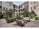 Beautiful courtyard featuring lush landscaping, a tranquil fountain, and comfortable seating for relaxing outdoor enjoyment at 355 E Ohio St # 310, Indianapolis, IN 46204