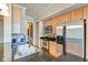 Modern kitchen with stainless appliances, light cabinets, and granite counters at 355 E Ohio St # 310, Indianapolis, IN 46204