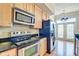 Well-equipped kitchen with stainless steel appliances and natural light at 355 E Ohio St # 310, Indianapolis, IN 46204