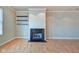 Living room with fireplace, hardwood floors, and lots of natural light at 355 E Ohio St # 310, Indianapolis, IN 46204