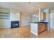 Open concept living room features a fireplace and wood floors at 355 E Ohio St # 310, Indianapolis, IN 46204