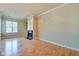 Bright living room with hardwood floors, fireplace, and natural light at 355 E Ohio St # 310, Indianapolis, IN 46204