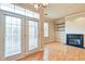 Bright living room with fireplace, hardwood floors and natural light at 355 E Ohio St # 310, Indianapolis, IN 46204