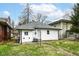A well maintained backyard with healthy lawn and concrete paver path in a desirable residential neighborhood at 3559 Carrollton Ave, Indianapolis, IN 46205