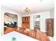 A spacious dining area with a hutch sits between the living room and a hallway at 3559 Carrollton Ave, Indianapolis, IN 46205