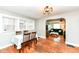 Cozy dining room open to the living area, filled with natural light at 3559 Carrollton Ave, Indianapolis, IN 46205