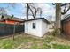 Detached one-car garage offers secure parking and additional storage space in the backyard at 3559 Carrollton Ave, Indianapolis, IN 46205