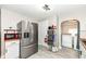 Spacious kitchen boasts stainless steel appliances, ample storage, and convenient access to the laundry area at 3559 Carrollton Ave, Indianapolis, IN 46205