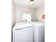 Bright laundry room equipped with modern washer and dryer, making laundry chores a breeze at 3559 Carrollton Ave, Indianapolis, IN 46205