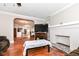 Cozy living room flowing into kitchen area with beautiful wood floors at 3559 Carrollton Ave, Indianapolis, IN 46205