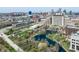 Breathtaking aerial view of the city skyline, buildings, lush greenery, and a serene pond at 358 Terrace Ave, Indianapolis, IN 46225