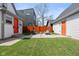 Large grass backyard with privacy fence, patio with modern outdoor furniture, and ample space at 358 Terrace Ave, Indianapolis, IN 46225