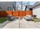 Outdoor patio with stylish outdoor furniture and a modern fire pit with privacy fencing at 358 Terrace Ave, Indianapolis, IN 46225
