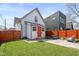 Backyard featuring a patio with a modern seating area, well-maintained lawn, and privacy fencing at 358 Terrace Ave, Indianapolis, IN 46225