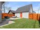 Relaxing backyard seating area with a well-manicured lawn and privacy fence at 358 Terrace Ave, Indianapolis, IN 46225