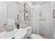 Bathroom featuring marble tiling, a chrome faucet, and a shower with a rainfall shower head at 358 Terrace Ave, Indianapolis, IN 46225