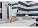 Modern bathroom features an updated vanity with marble countertop and sleek faucet at 358 Terrace Ave, Indianapolis, IN 46225