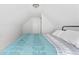 Bedroom with slanted ceiling featuring a comfortable bed and bright natural light at 358 Terrace Ave, Indianapolis, IN 46225