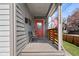 Welcoming porch featuring seating, an American flag, and a view of the neighborhood at 358 Terrace Ave, Indianapolis, IN 46225