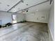 Spacious garage featuring concrete flooring, ample storage, and an automatic door system at 358 Terrace Ave, Indianapolis, IN 46225