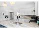 Open concept kitchen with a large island, stainless steel appliances, and modern lighting fixtures at 358 Terrace Ave, Indianapolis, IN 46225