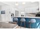 Modern kitchen featuring a stylish island with seating and high-end appliances, next to dining area at 358 Terrace Ave, Indianapolis, IN 46225