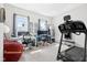 Bright and modern home office with treadmill, two desks, and natural light at 358 Terrace Ave, Indianapolis, IN 46225