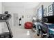 Bright and modern home office with treadmill, two desks, and natural light at 358 Terrace Ave, Indianapolis, IN 46225