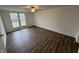 Bright bedroom with a ceiling fan and windows overlooking the yard at 3734 Ontario Cir, Indianapolis, IN 46268