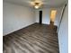 Bedroom with ceiling fan, and modern flooring leading to bathroom at 3734 Ontario Cir, Indianapolis, IN 46268