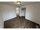 A bedroom offers hardwood floors, a ceiling light, and leads into the closet area, spacious and bright at 3734 Ontario Cir, Indianapolis, IN 46268