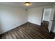 A comfortable bedroom provides hardwood floors, base molding and is well-lit with a ceiling lamp at 3734 Ontario Cir, Indianapolis, IN 46268