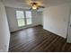 This bedroom includes a ceiling fan, a window to the outside, and a large closet for storage at 3734 Ontario Cir, Indianapolis, IN 46268