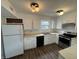 Well-lit kitchen with white cabinets, stainless steel appliances, and ample counter space at 3734 Ontario Cir, Indianapolis, IN 46268