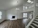 Spacious living room with brick fireplace, high ceilings, and wood floors at 3734 Ontario Cir, Indianapolis, IN 46268