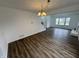 Open-concept living area with wood floors and plenty of natural light at 3734 Ontario Cir, Indianapolis, IN 46268