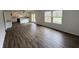 Open living area with wood floors, natural light, and view of the kitchen at 3734 Ontario Cir, Indianapolis, IN 46268