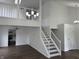 Bright, open living room with wood floors and staircase to second level at 3734 Ontario Cir, Indianapolis, IN 46268