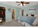 Bedroom with neutral walls, ceiling fan, Primary closet, and en suite bathroom at 4345 Elkhorn Dr, Westfield, IN 46062