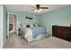 Bedroom featuring neutral walls, ceiling fan, ensuite Bedroom, and a dark wood dresser at 4345 Elkhorn Dr, Westfield, IN 46062