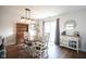Cozy dining area featuring a wooden table, chairs, and a sliding glass door to the outside at 4345 Elkhorn Dr, Westfield, IN 46062